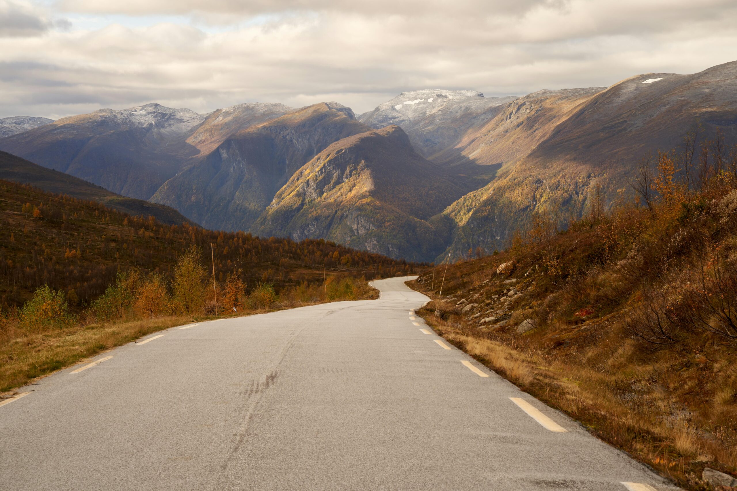 Captivating journey through Aurlandsvangen, Norway, with vivid autumn colors and majestic mountains.